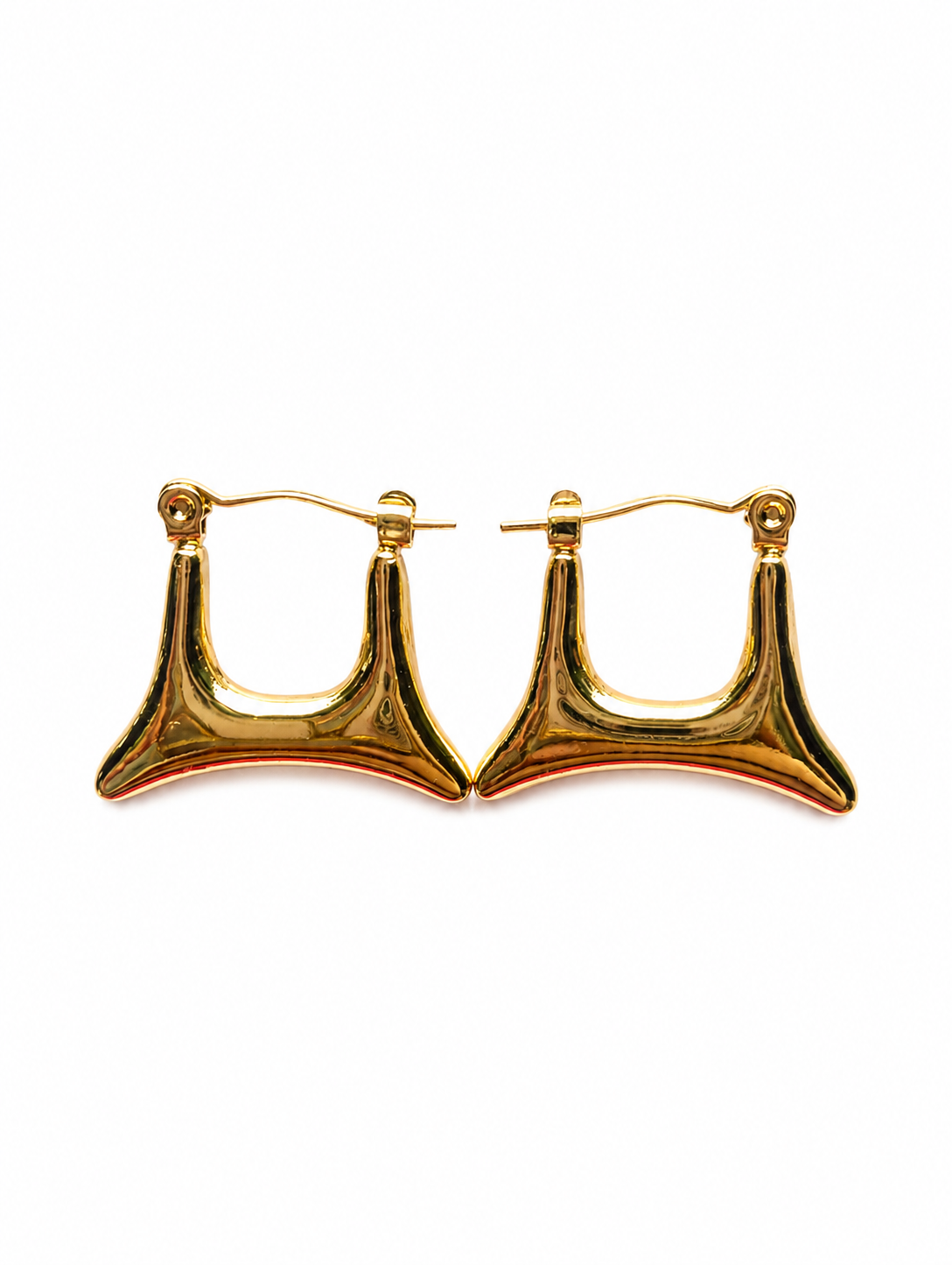 A pair of gold hoop earrings with a unique, wide, curved triangular drop design, shown on a plain white background.