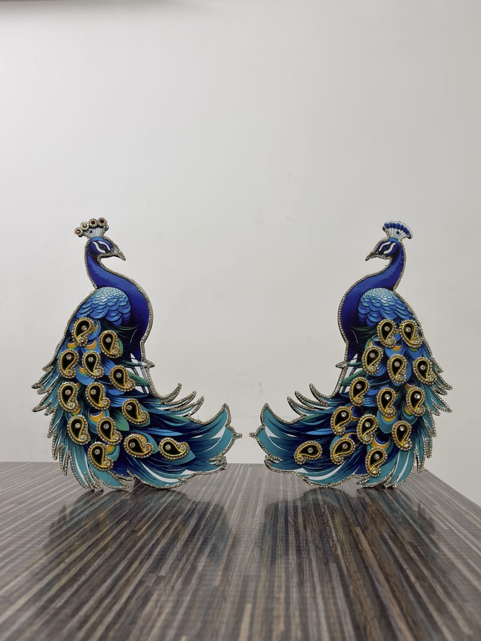 Decorative royal blue peacock pair showpiece with rhinestone detailing and paisley feather pattern