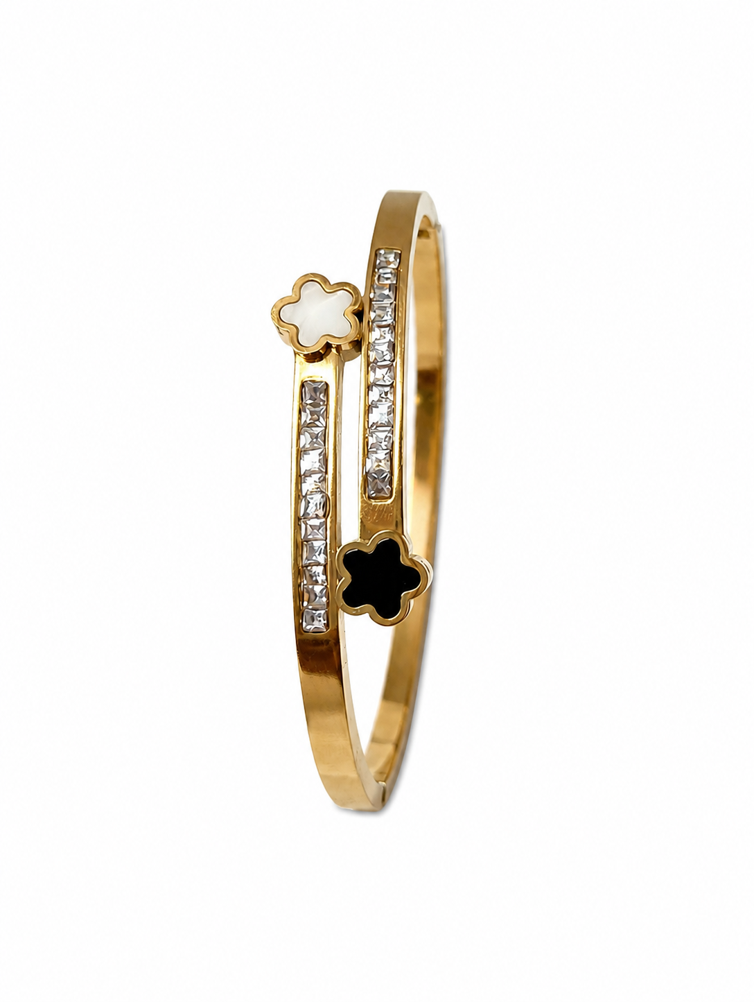 Gold bracelet with floral designs and embedded stones on a white background