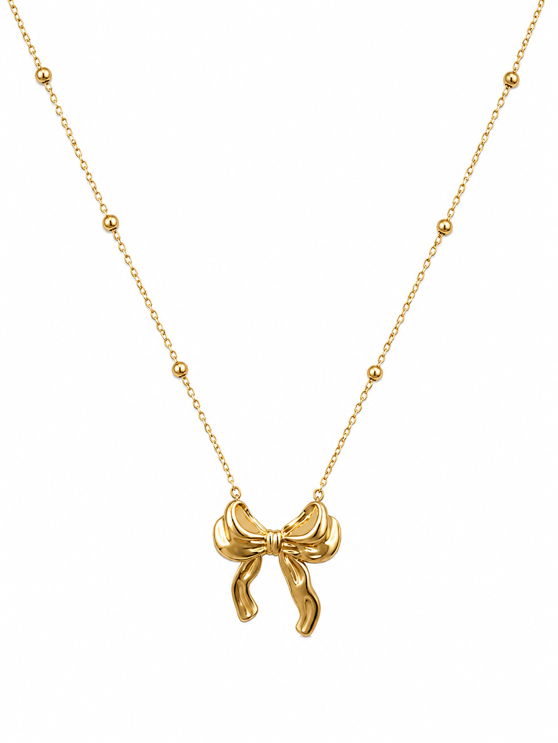 A gold necklace featuring a small bow-shaped pendant suspended from a delicate chain with small gold bead accents, shown against a plain white background.