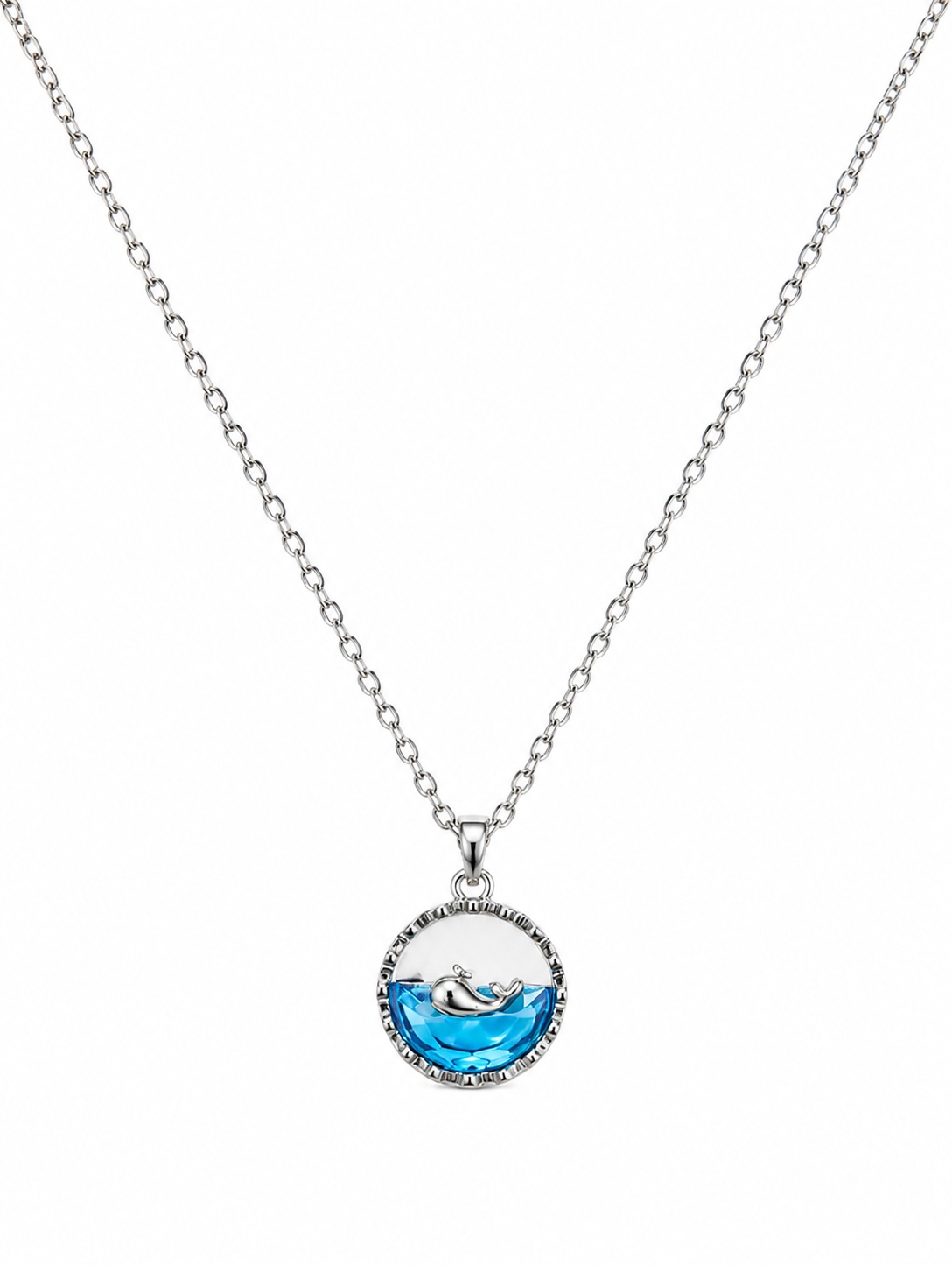 A silver chain necklace with a circular pendant featuring a blue wave design and a small silver dolphin in the center, shown against a plain white background.