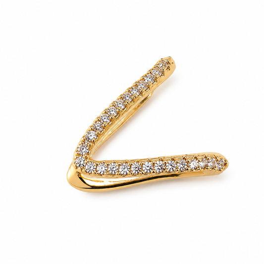Gold V-shaped earring with diamonds on a white background
